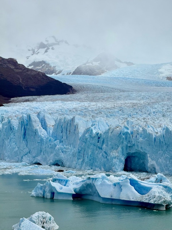 The blue-white front of the Perito Moreno Glacier meeting a grey-green lake