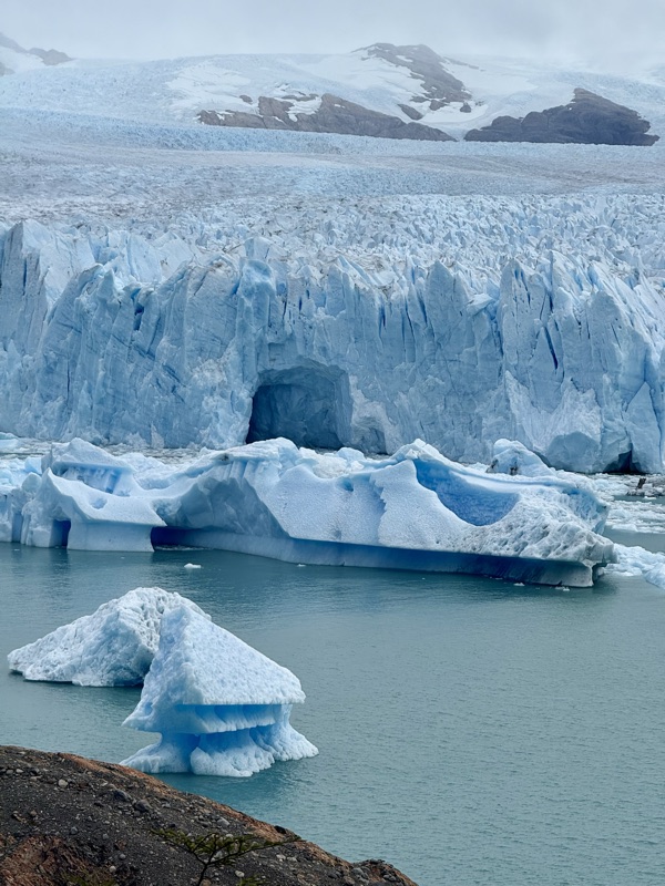 The jagged blue front of the Perito Moreno Glacier, icebergs floating below
